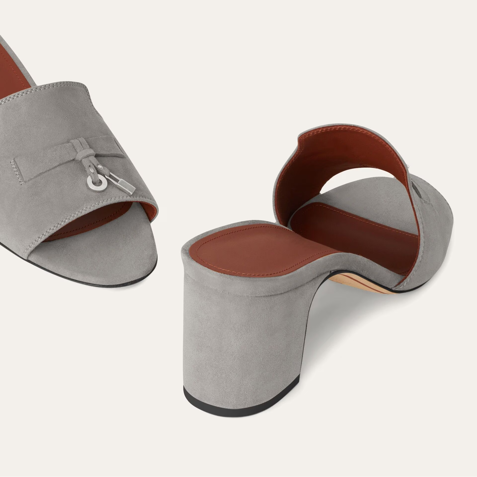 Gray sandals with brown soles on a white background